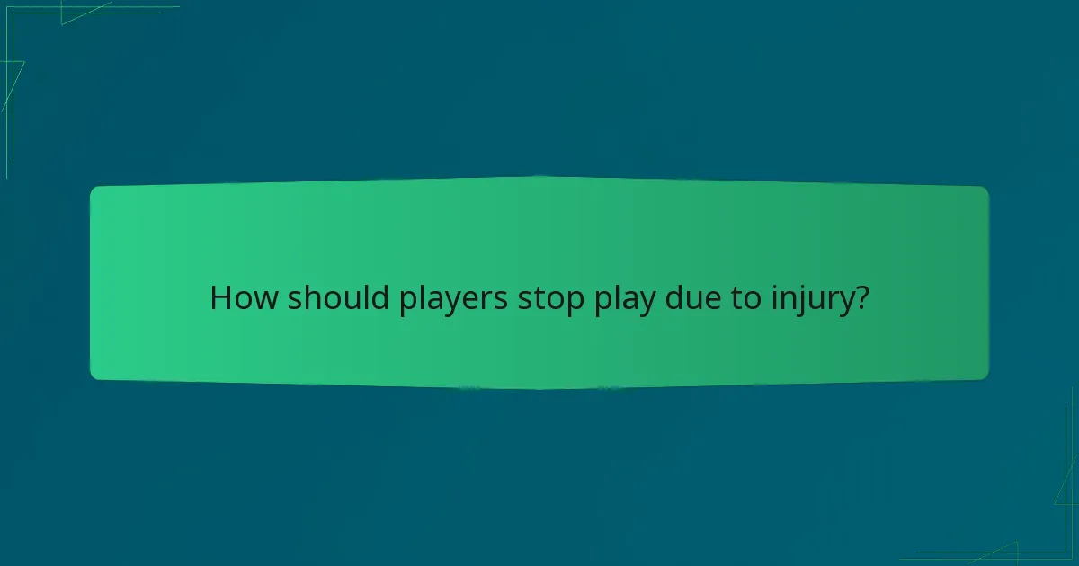 How should players stop play due to injury?